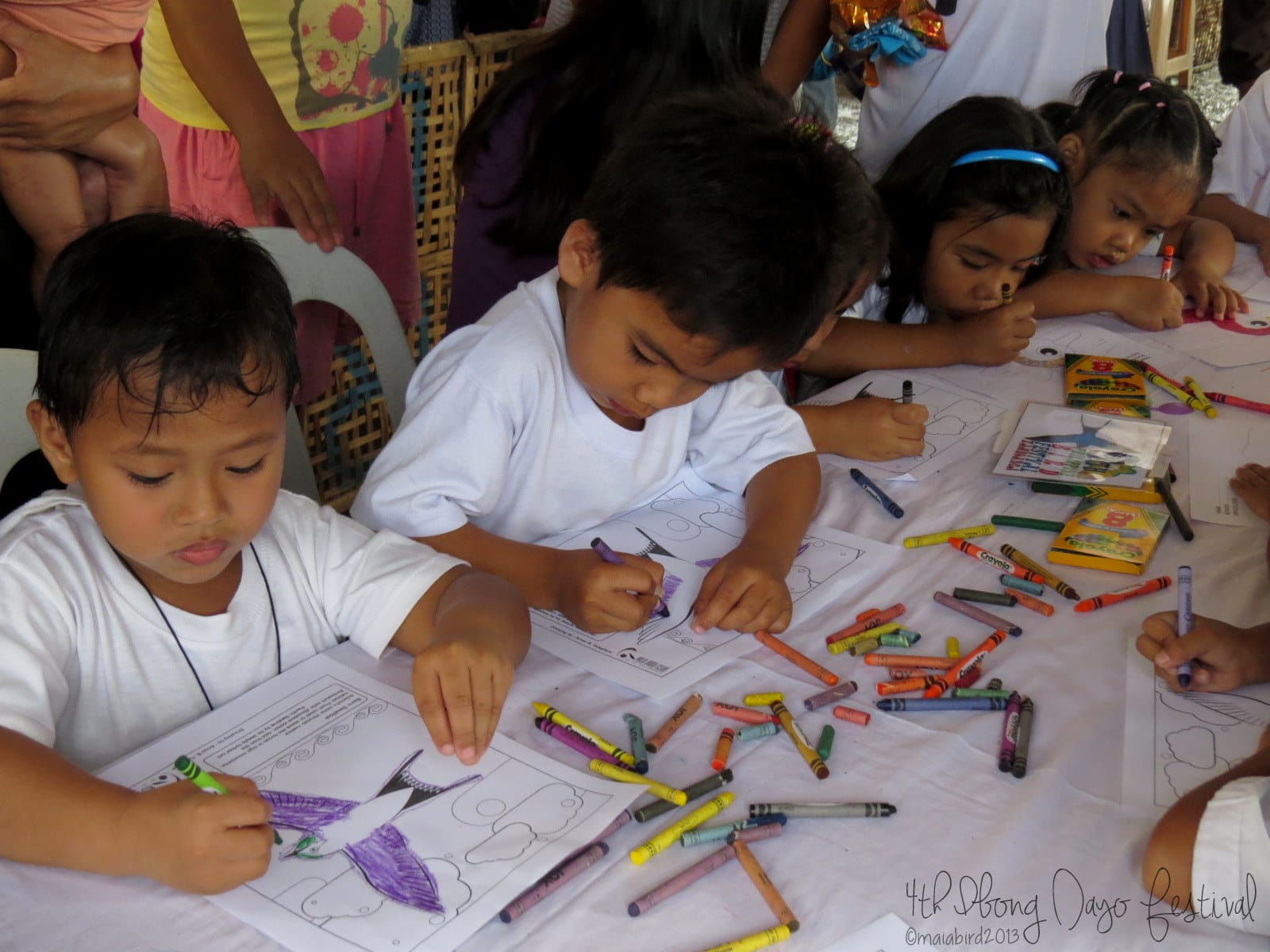 Lots of young artists flocked to the coloring booth. Photo by Maia Tanedo
