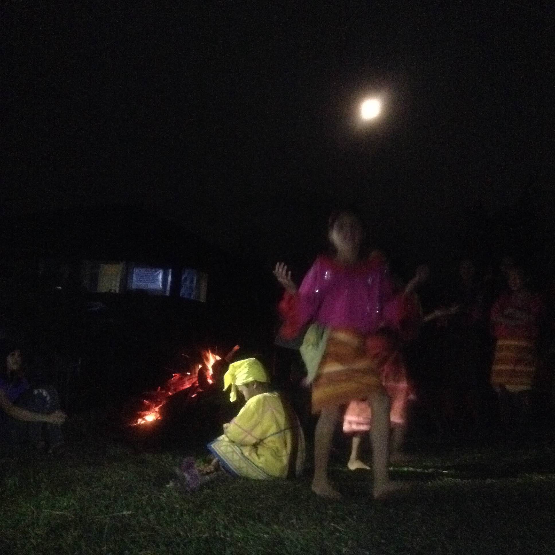 Community exchange before dinner: the children gave a delightful performance under a full moon. Photo by Trinket Constantino.